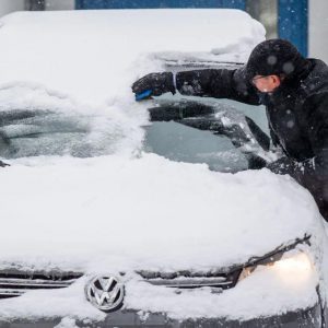 DIY winter hacks using credit card to remove snow on a car