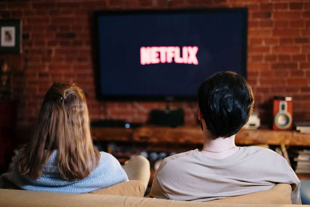 Couple watching movie with Netflix Canada subscription