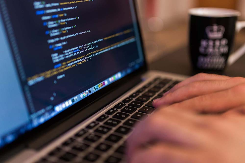 Web Developer in front of her laptop