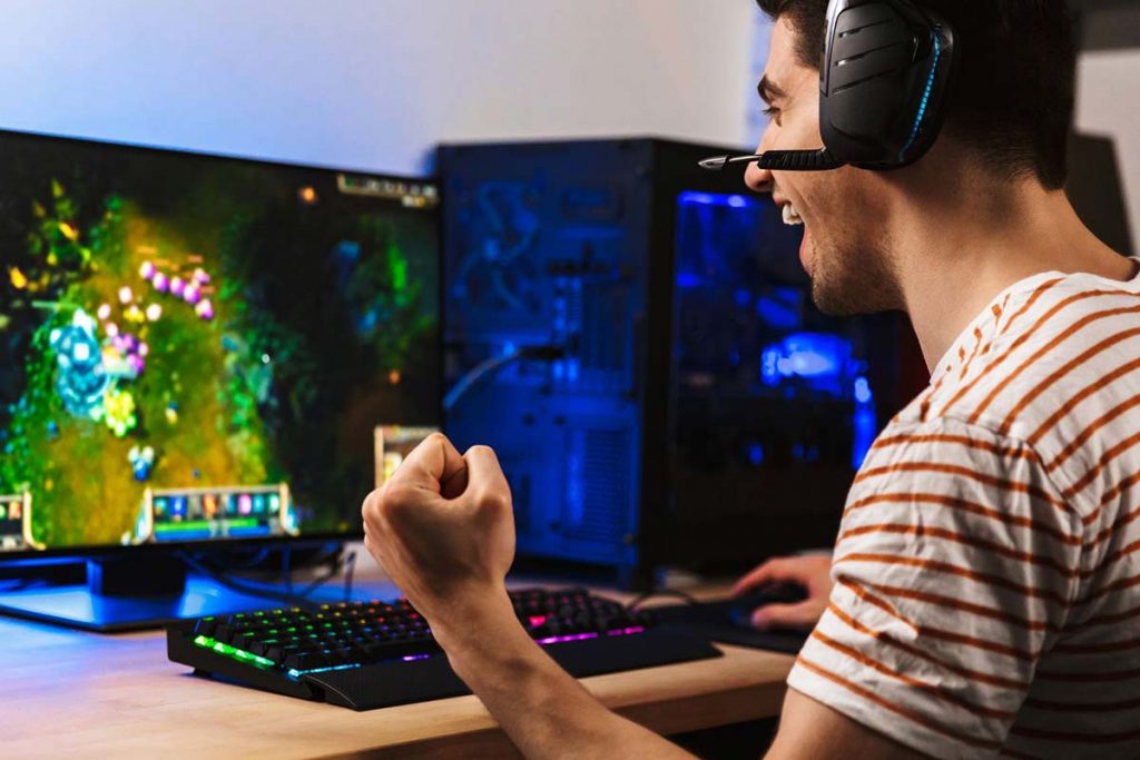 teenager playing the best pc games