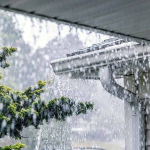 Drenching Rain Storm Water Pouring Over Roof Gutter