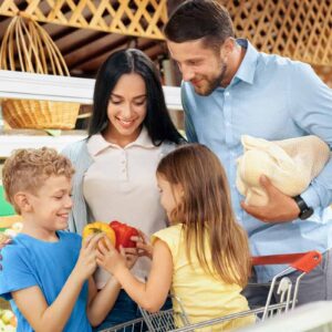 Canadian Family choosing vegetables and shopping in supermarket