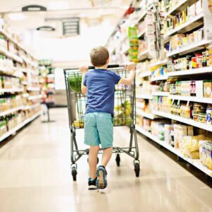 Young Canadian boy inside the best grocery supermarket in Canada