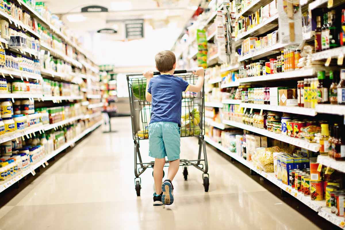 Young Canadian boy inside the best grocery supermarket in Canada