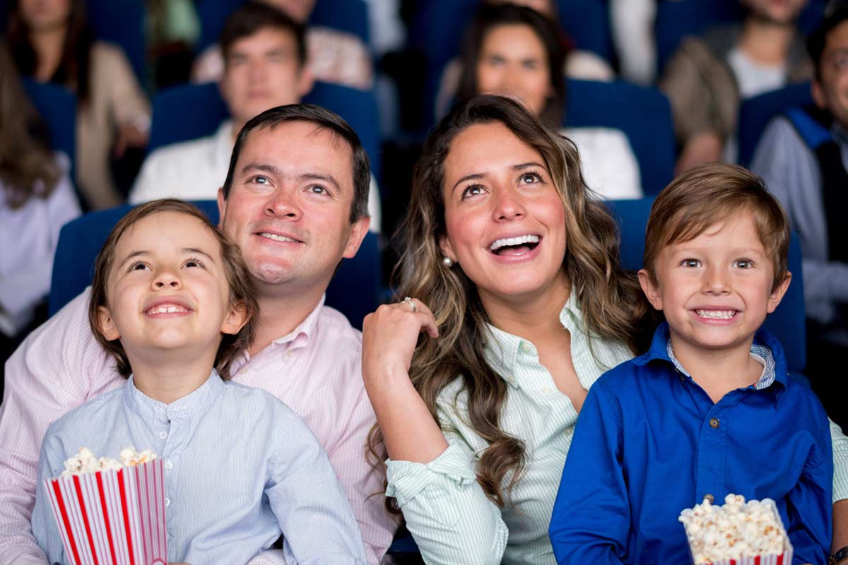 Family enjoying cineplex movie with scene+ rewards