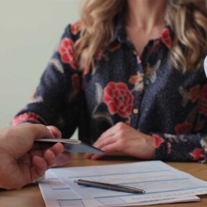 Newcomer to Canada talking to Canadian woman immigration officer